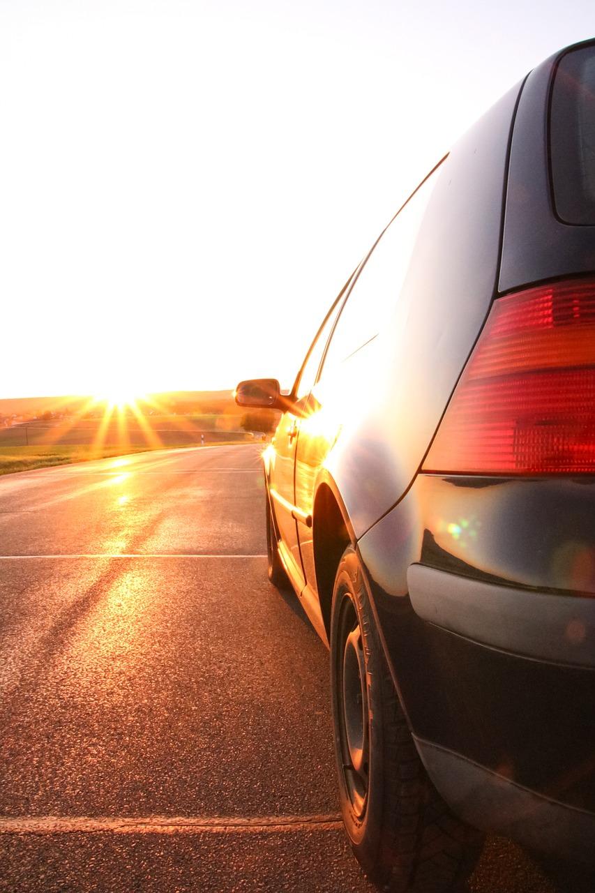 rear of a car stopped at the side of a road