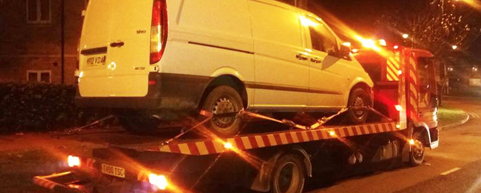 Transit van loaded onto a recovery trailer in Nottingham, roadside assistance.