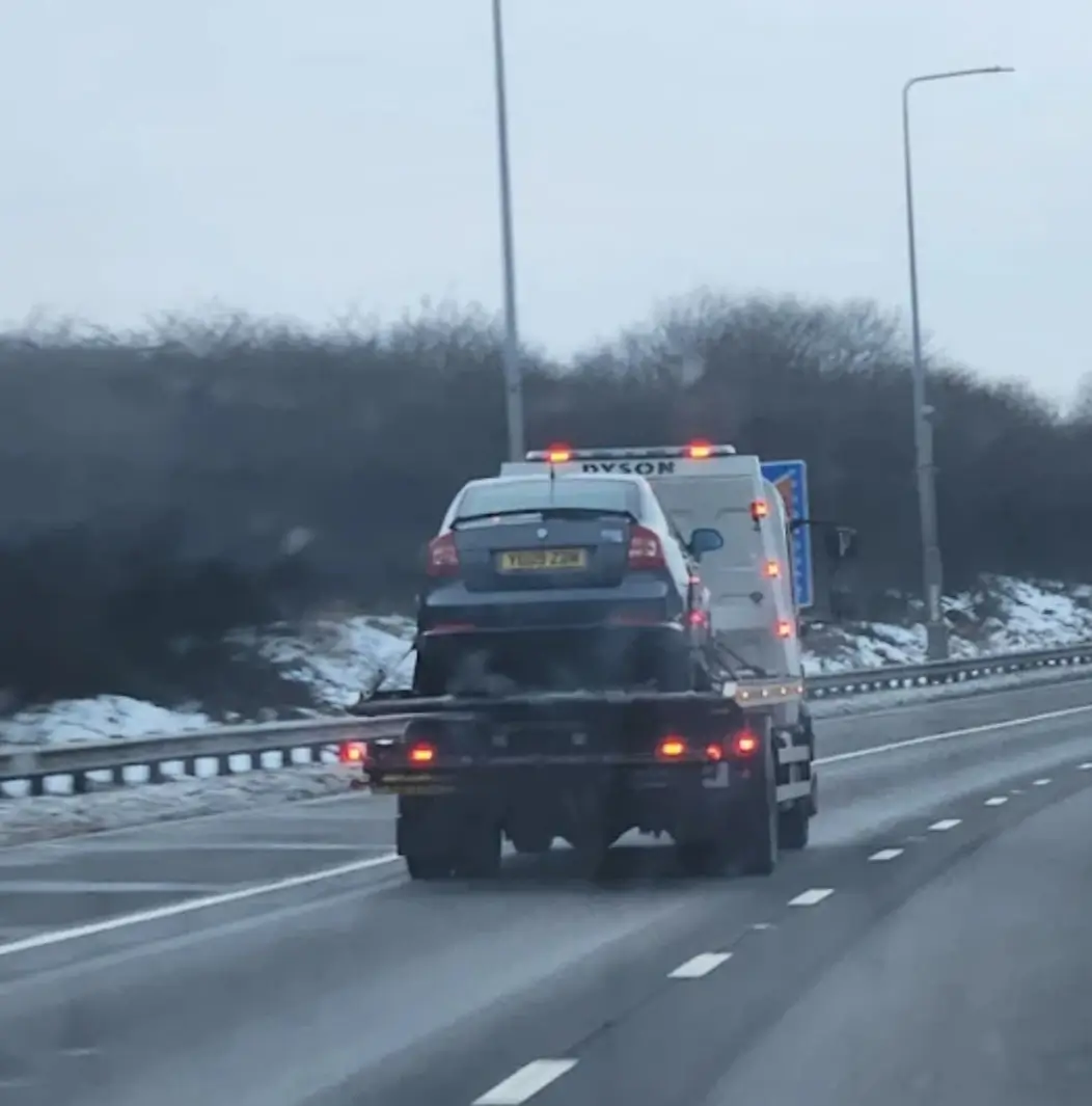 Vehicle on the back of a roadside assistance recovery truck in Ardsley Leeds West Yorkshire